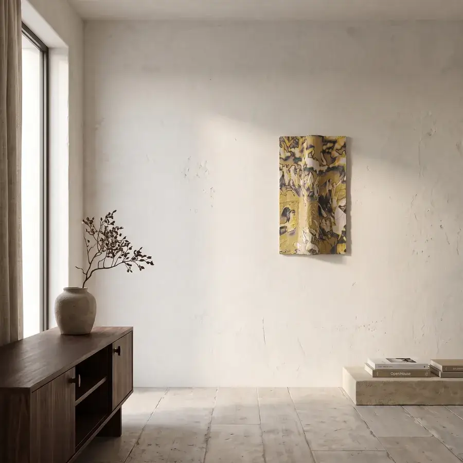 A quiet whitewashed Mediterranean interior at dusk with a single relief on the far wall barely catching the last low light
