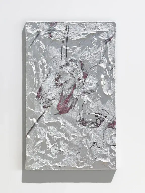 The same TULIP XI relief lit from the right: the texture reads again but a different set of ridges catches the light